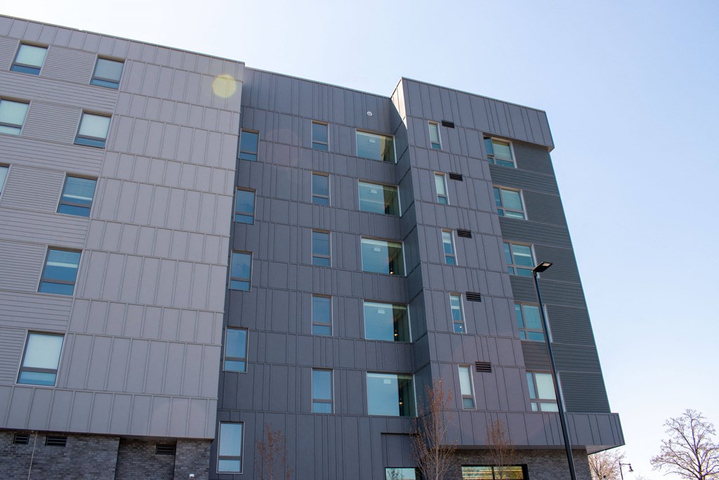 the side of a building with a blue sky in the background