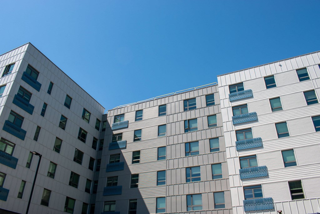 two buildings with a blue sky in the background