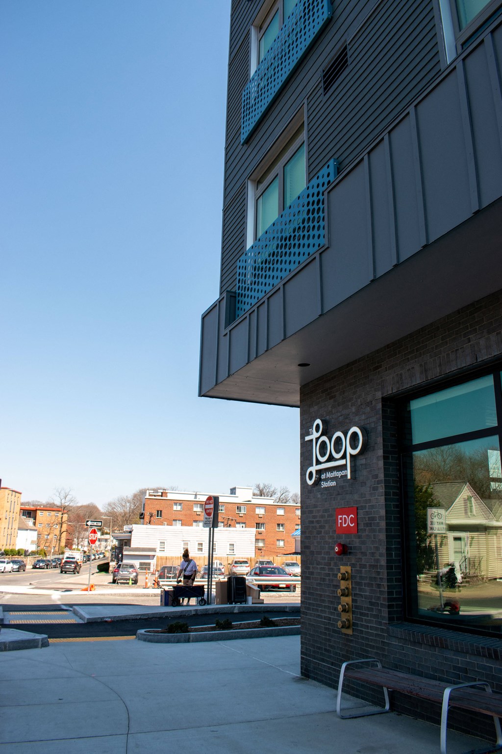 a building with a sign on the side of a street