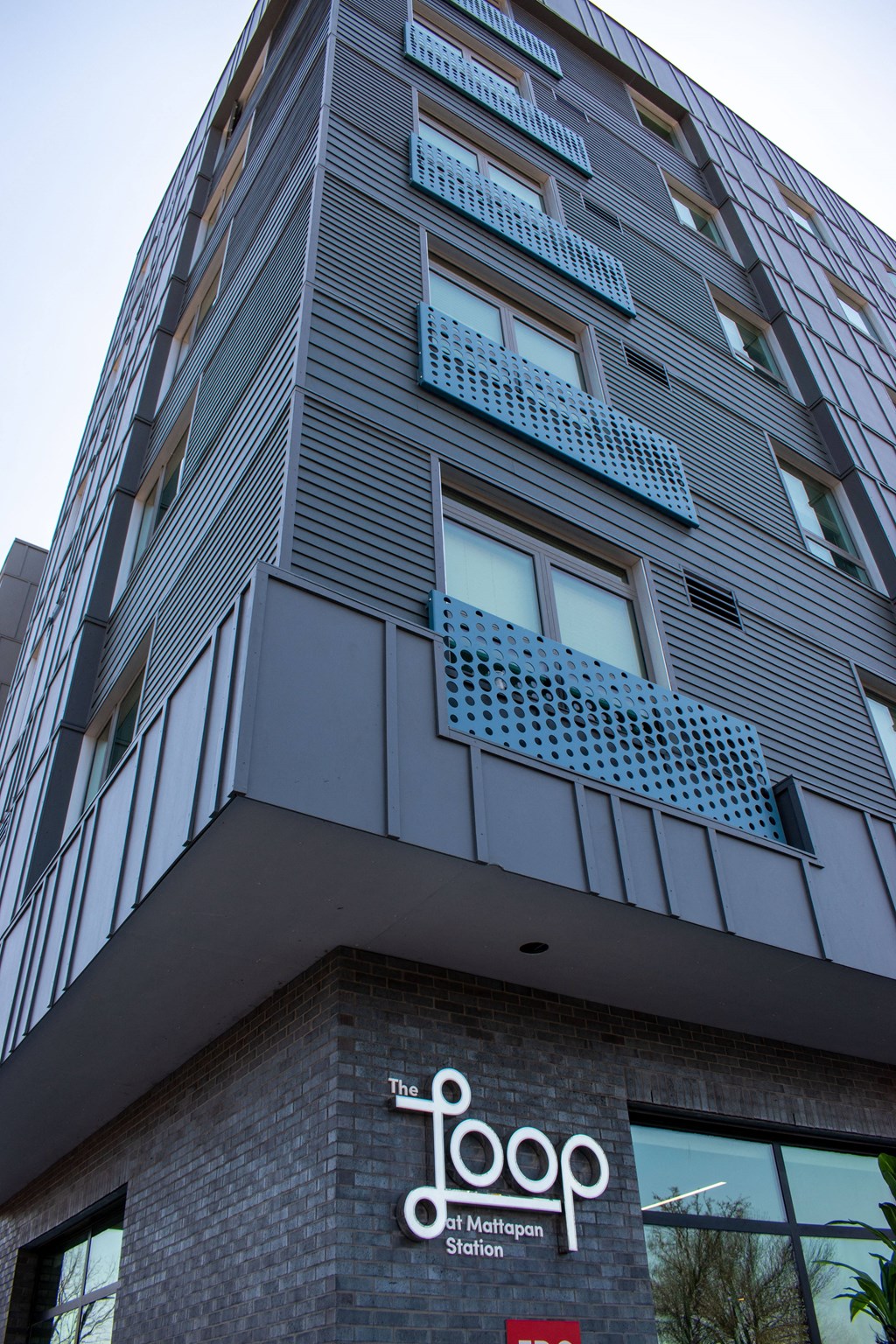 a tall building with a sign on the side of it