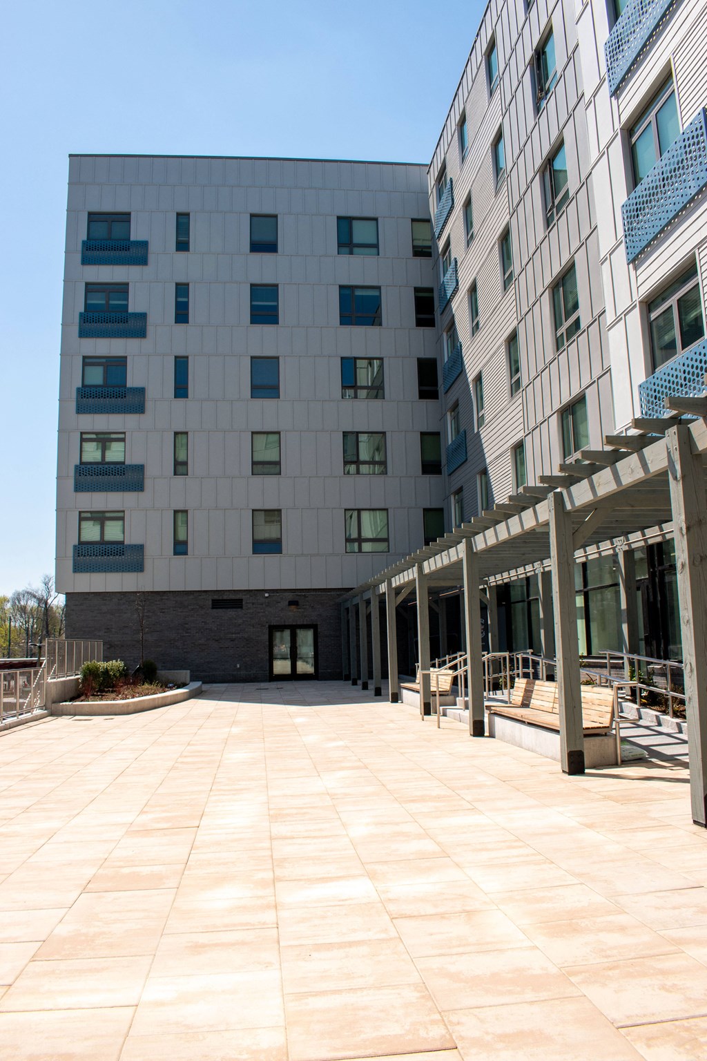 a large building with a patio in front of it