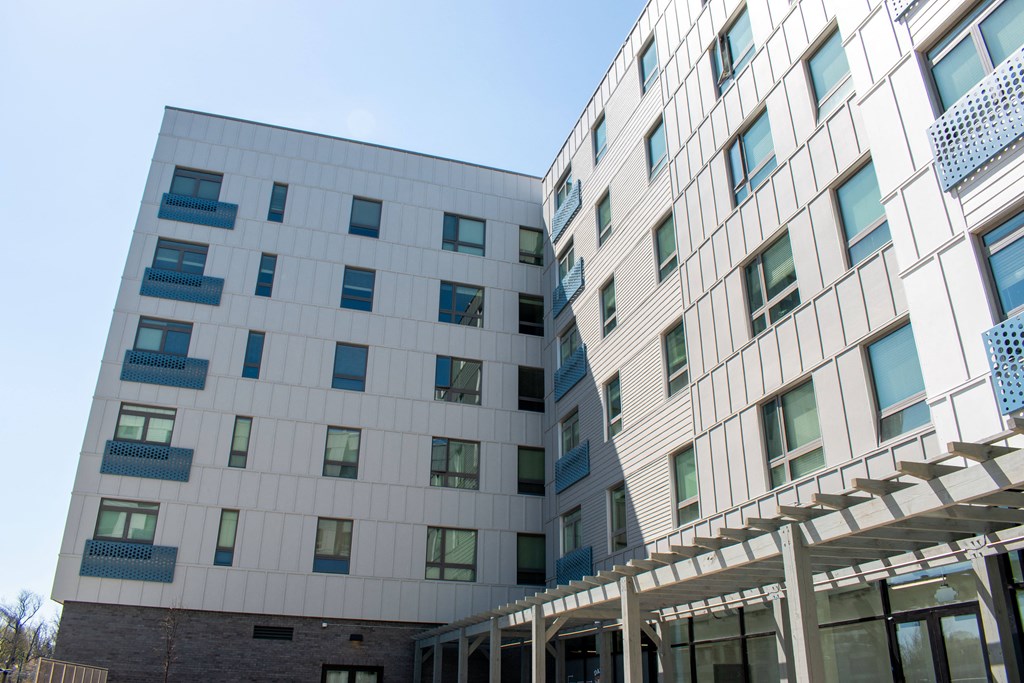 two buildings with a clear blue sky in the background