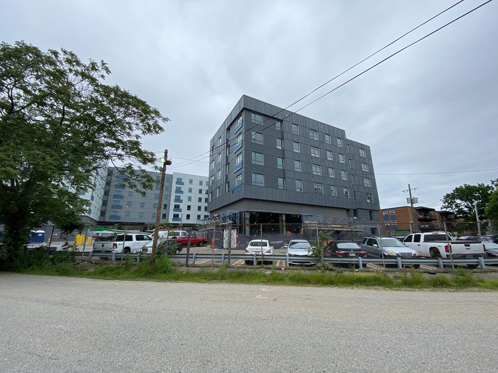a large building on the corner of a parking lot