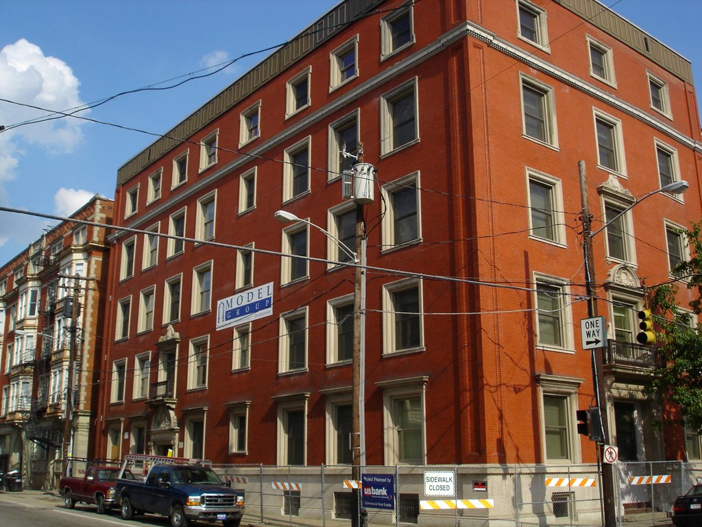 a large red building on a city street