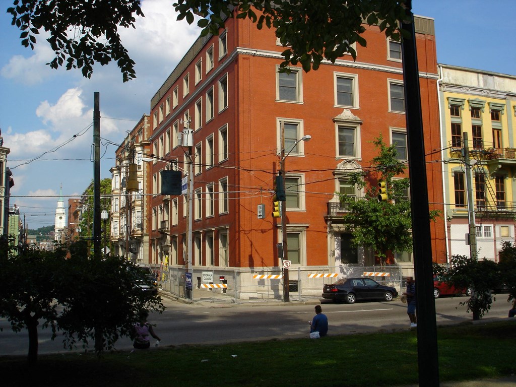 a large red brick building on a city street
