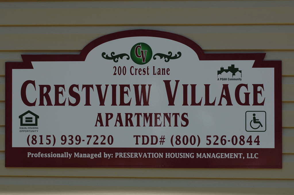 a sign for the cresent view village apartments