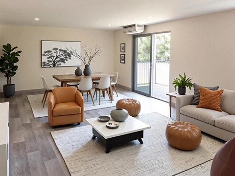 A living room with a brown chair and a white table.