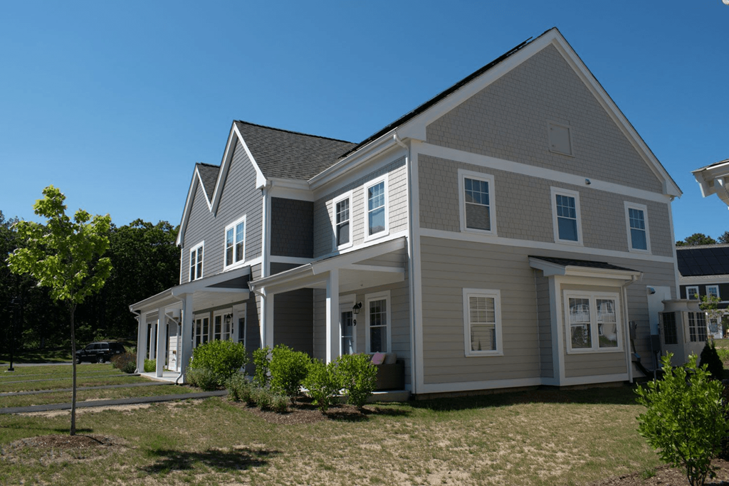 a large house with a grassy area in front of it