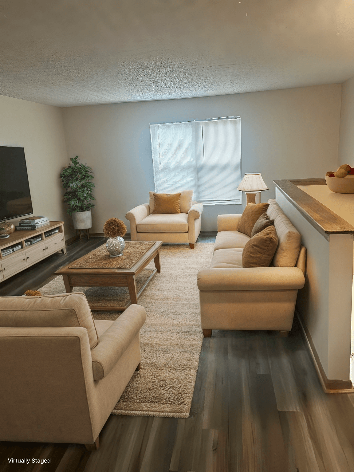 A living room with a couch, chair, and coffee table.