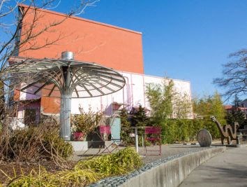 a large building with a sculpture in front of it