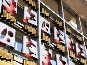 a display of different types of logos on a wall
