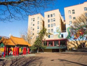 a building with a pagoda in the middle of a park