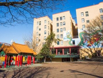 a building with a pagoda in the middle of a park