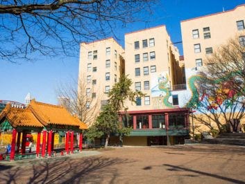 a building with a pagoda in the middle of a park