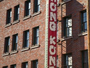 a red and white sign on the side of a building