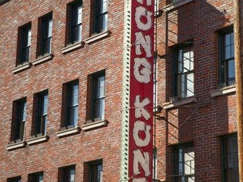 a red and white sign on the side of a building