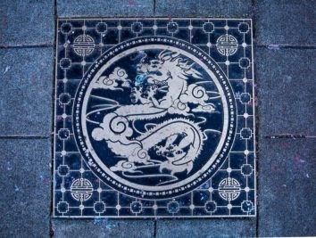 a blue and white dragon tile on the ground