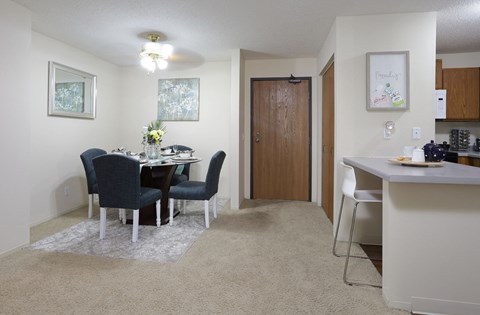 Spacious dining room and breakfast bar at Claremont Apartments in Minnetonka Minnesota.