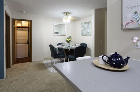 Spacious dining room, breakfast bar and washer and dryer at Claremont Apartments in Minnetonka Minnesota.
