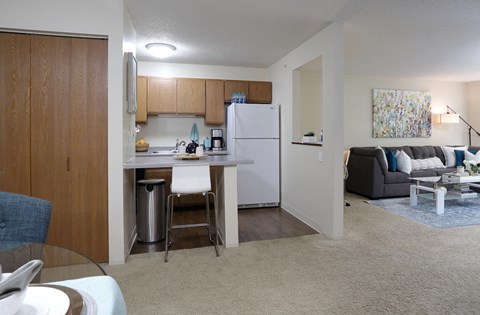 Spacious dining room and breakfast bar at Claremont Apartments in Minnetonka Minnesota.