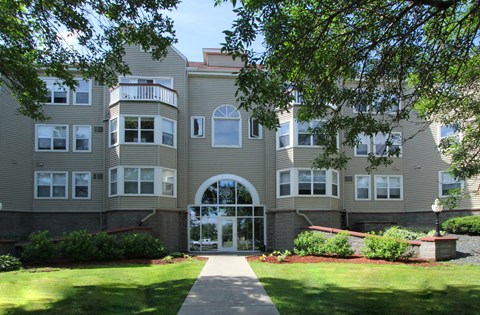 Apartments set in a nature preserve with elevators and controlled access entry at Claremont Apartments in Minnetonka, Minnesota