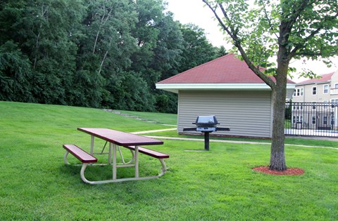 Apartments set in a nature preserve with beautiful scenic views, grilling station, and picnic area at Claremont Apartments in Minnetonka, Minnesota