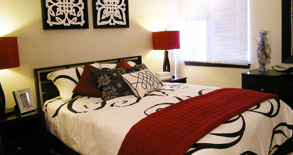 a bedroom with a bed and some pillows on it