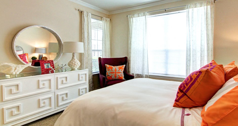 Large bedroom with large walk-in closet, crown molding, and 9-12 foot ceilings.