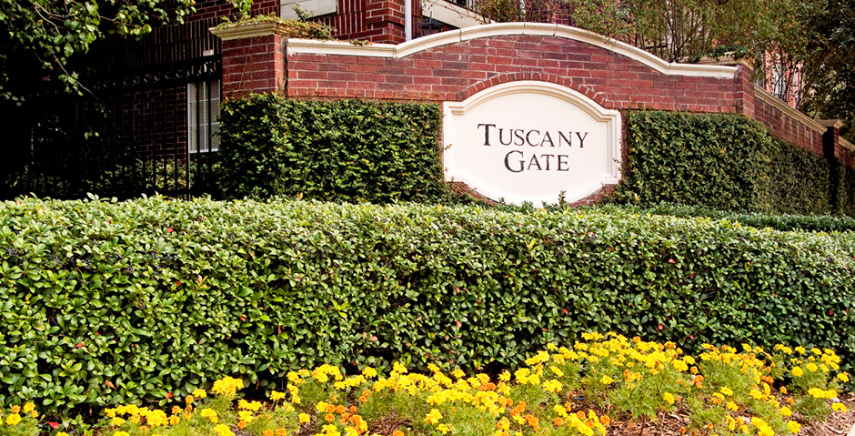 a sign in front of a brick building
