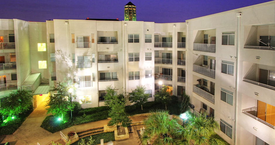 Luxury apartments in the Las Colinas area with a beautiful courtyard, landscaped courtyard, luxury courtyard, fountain, zen garden, and firepit