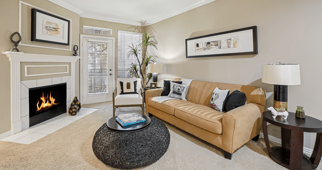 A living room with a fireplace and a couch.