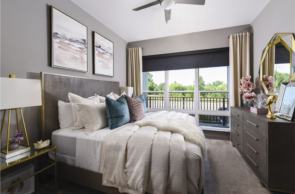 Luxury apartments with master bedroom to fit a king size bed, attached master bathroom and walk-in closet at Xenia Apartments in Golden Valley, Minnesota