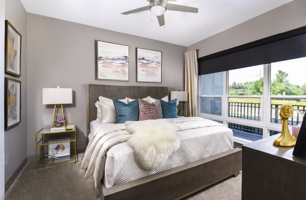 Luxury bedroom with walk-in closet and scenic views at Xenia Apartments in Golden Valley, Minnesota