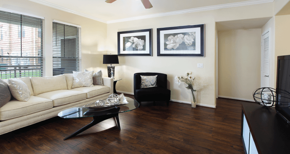 Luxury apartments in Houston with spacious open floor plan with oversized windows, lots of natural light, and hardwood floors.