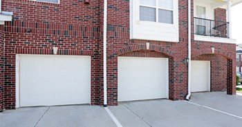 Luxury townhomes with attached garages and red brick exterior next to Rockledge Shopping Center in South Lincoln Nebraska - Photo Gallery 31