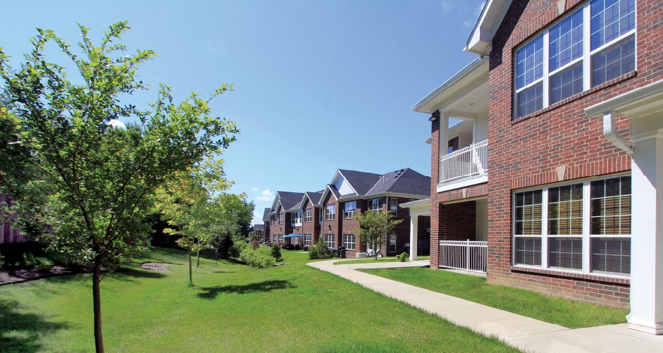 Luxury townhomes with attached garages, scenic views and red brick exteriors at Bellemeade Apartments in west Des Moines