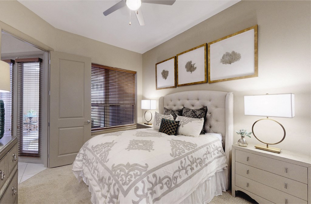 Luxury apartments with spacious master bedroom to accommodate a king-size bed and dresser with walk-in closet and master bathroom at Tuscany Walk Apartments in Houston Texas.