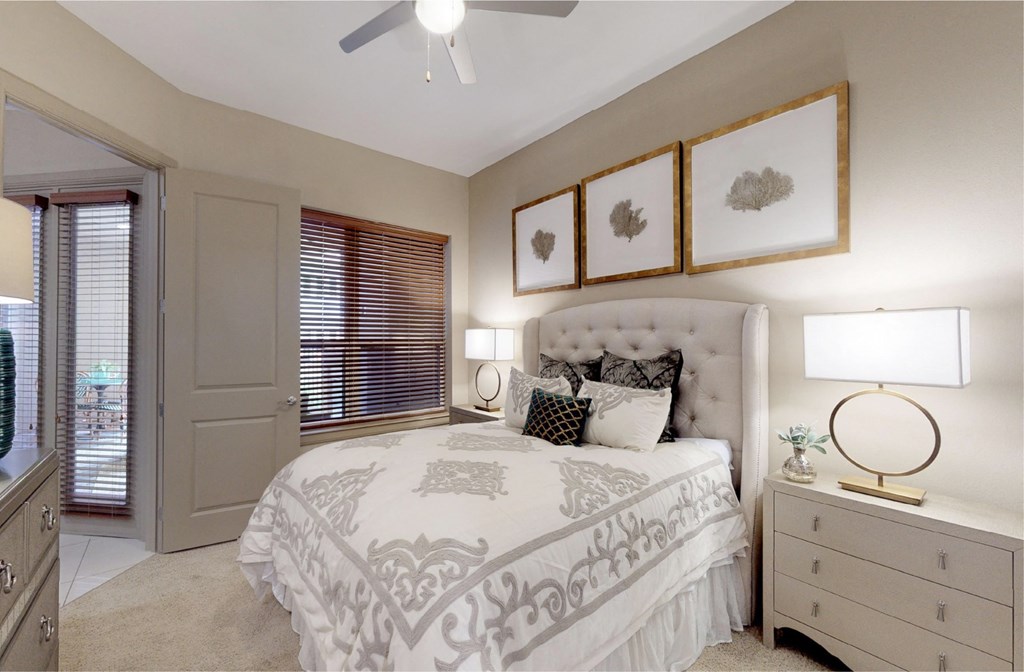 Luxury apartments with spacious master bedroom to accommodate a king-size bed and dresser with walk-in closet and master bathroom at Tuscany Walk Apartments in Houston Texas.