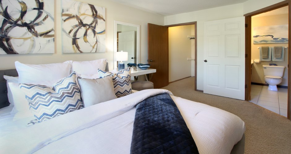 Spacious master bedroom with attached walk-in closet and master bathroom at Tanglewood Apartments in Lincoln, Nebraska