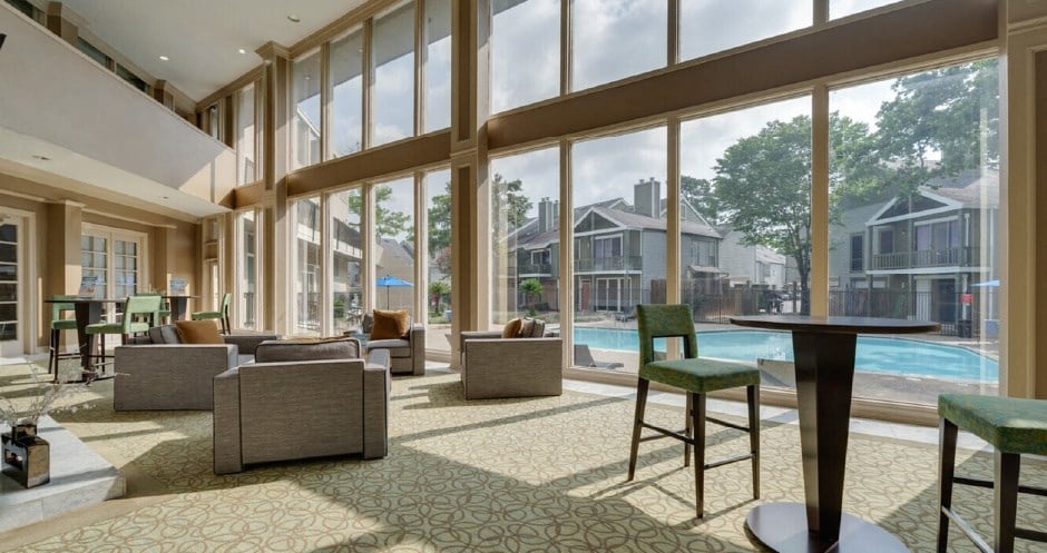 Huge clubhouse with spacious resident lounge, free wi-fi, coffee bar, and fitness center at Woodlake on the Bayou Apartments in Houston.