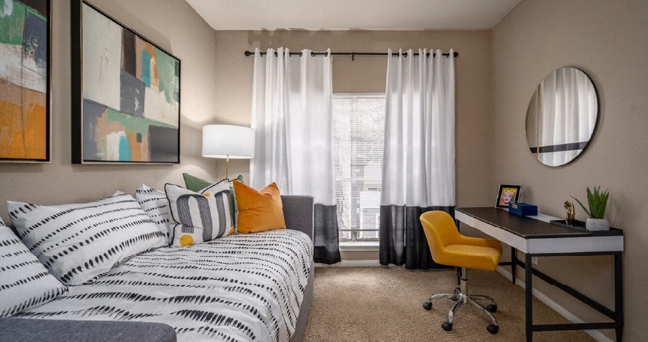 Spacious den or office area with 9-foot ceilings at Woodlake on the Bayou Apartments in Houston.