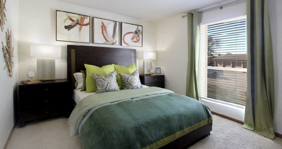 Spacious bedroom with walk-in closet, huge bedroom with oversized windows, attached bathroom at LionsGate Apartments in Lincoln, Nebraska