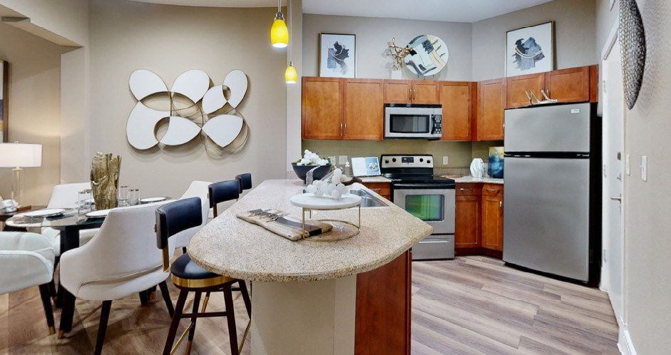 Luxury apartments with granite countertops, stainless appliances, large kitchen island at Delante apartments in Irving Texas