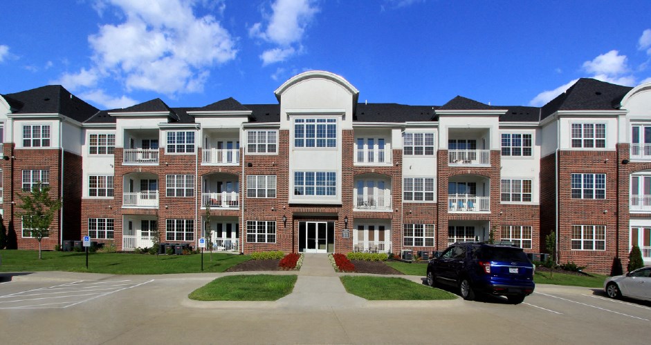 Luxury apartments in a gated community with brick exteriors and underground parking garage at Bellemeade Apartments in west Des Moines