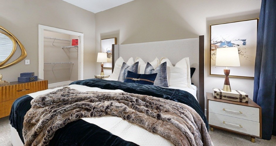 Spacious bedroom with large walk-in closet at Delante Apartments in Irving Texas