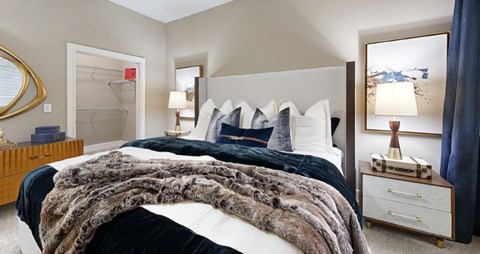 Spacious bedroom with large walk-in closet at Delante Apartments in Irving Texas