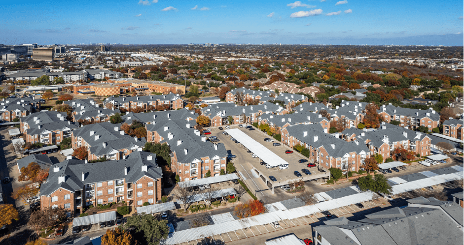 Gated luxury apartment community in north Dallas with red brick exteriors at The Saxony Apartments