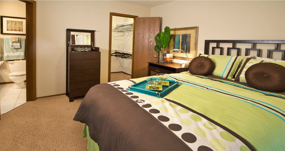 Spacious master bedroom with walk-in closet and master bathroom at LionsHead Apartments in Omaha, Nebraska