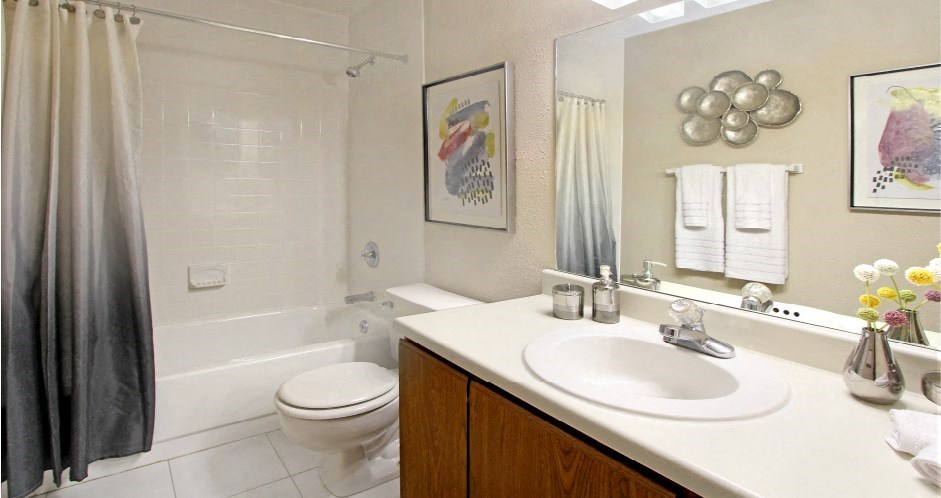 Bathroom with tile floor and tile shower and extra cabinet space at LionsGate Apartments in Lincoln, Nebraska