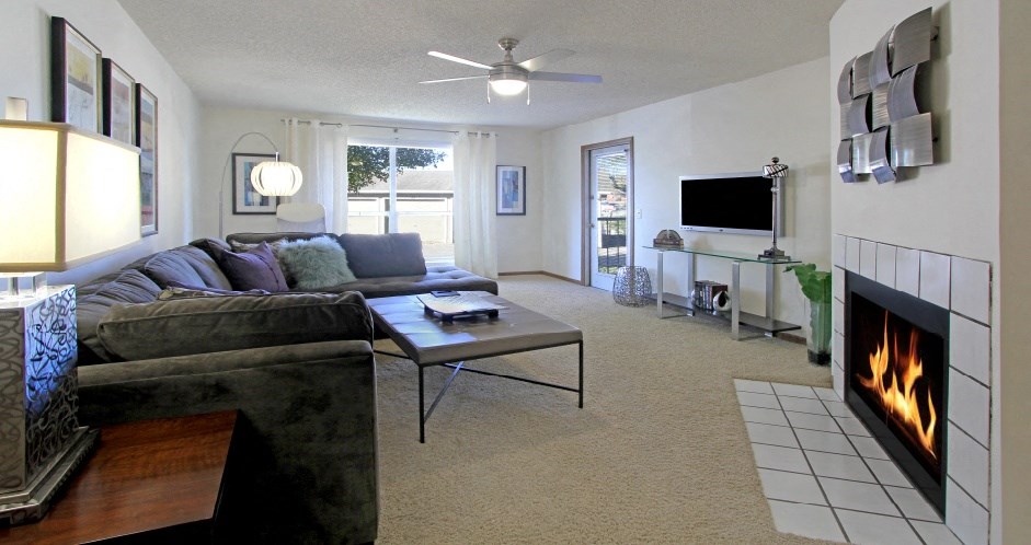 a living room with a fireplace and a couch